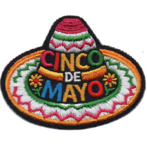 An embroidered patch of a colorful sombrero with the words "Cinco de Mayo" in bright letters across the front, decorated with vibrant patterns and small flower details.