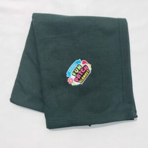 A folded Carolina blue Patch Blanket with a colorful embroidered patch reading “FUN PATCH BLANKET” displayed on a white background.