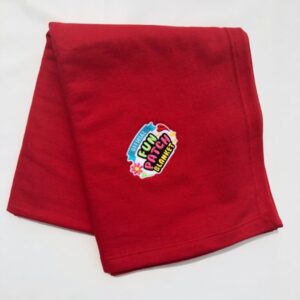 A folded Carolina Blue Patch Blanket with a colorful "Original Fun Patch Blanket" patch and flower illustrations, displayed on a white background.