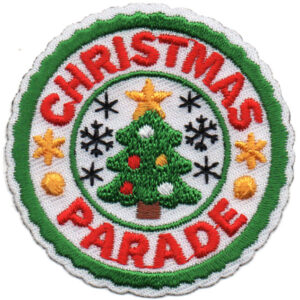 The Christmas Parade Patch (Copy) is a circular embroidered patch featuring a decorated Christmas tree, stars, snowflakes, and "CHRISTMAS PARADE" in red around the edge.
