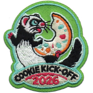 The 2026 Cookie Kick Off patch features a cartoon ferret holding a bitten, spotty cookie, with "COOKIE KICK-OFF 2026" text on a green background.