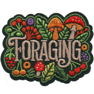 The Foraging Patch features "Foraging" embroidered amidst colorful mushrooms, leaves, berries, and flowers on a dark green background.