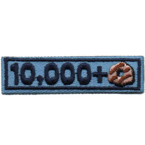 Rectangular embroidered patch called "9000+ Patch" features a light blue background, dark blue border, "9000+" in dark blue text, and a brown and tan swirl design resembling a knot at the end.