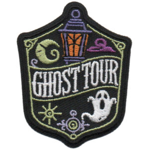 The Ghost Tour Patch (Copy) is a shield-shaped embroidered patch with an orange lantern, ghost, purple clouds, "GHOST TOUR" in bold white letters, and decorative swirls and lines.