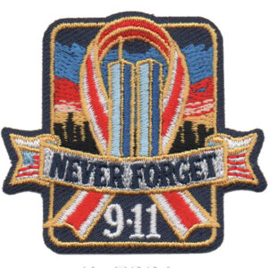 The Remember 9/11 Patch (Copy) features the twin towers, a red and white ribbon, city skyline, and "NEVER FORGET 9-11" in bold letters against a colorful sky.