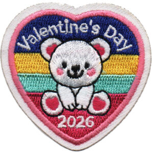 Heart-shaped embroidered patch featuring a white ferret, rainbow stripes (yellow, orange, green), and "Valentine's Day 2026" in white and pink letters. The border is white and pink. Product: 2026 Valentine's Day Patch (Ferret).