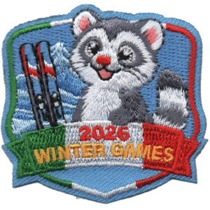 The 2026 Winter Games Patch (Copy) showcases a smiling raccoon with skis, snowy mountains, and a "2026 Winter Games" banner accented in green, white, and red like the Italian flag.