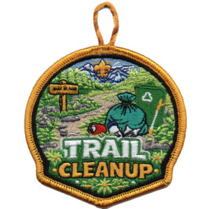 The Archery Scouting America (Copy) patch features embroidered mountains, trees, a trail with trash items, a signpost, recycling symbol, “TRAIL CLEANUP” text at the bottom, a yellow border, and a loop at the top.