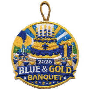 2026 Blue & Gold Banquet embroidered patch features a cake with candles, balloons, presents, blue and gold decorations, and a loop at the top.