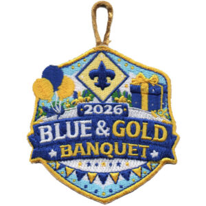 The 2026 Blue & Gold Banquet patch features a fleur-de-lis, balloons, a gift box, "Blue & Gold Banquet," and the year 2026 in blue and gold, with a decorative loop at the top.