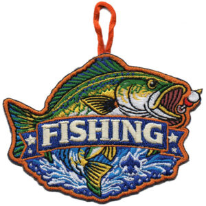 The Fishing Scouting America patch features a fish biting a red and white lure, “FISHING” in bold white letters, an orange string loop at the top, and a background of blue water with stars.