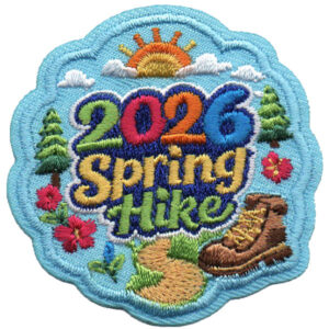 The Spring Hike Patch (Copy) features "2026 Spring Hike" in colorful letters with a sun, clouds, trees, flowers, trail, and hiking boot on a light blue background.