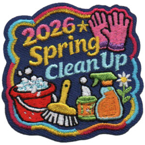 The Spring Clean Up Patch (Copy) features colorful embroidery with "2026 Spring Clean Up" text, pink gloves, a red bucket with bubbles, a scrub brush, cleaning bottles, a daisy, and a yellow star on a dark blue background.