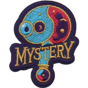 The Mystery (Question) Patch (Copy) features "MYSTERY" embroidered below an abstract magnifying glass and yin-yang design in vibrant blue, red, and yellow.