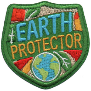 The Earth Day Patch (Copy) is a green shield-shaped embroidered patch featuring "EARTH PROTECTOR" above an image of Earth, adorned with arrows, leaves, and colorful accents.