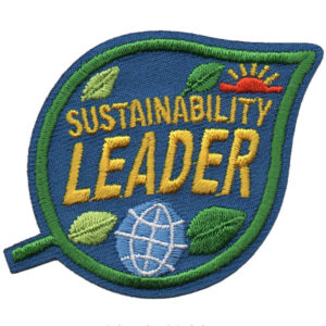 The Earth Day Patch (Copy) is an embroidered green leaf patch featuring "SUSTAINABILITY LEADER" in yellow, a small globe, green leaves, and a red sun on a blue background.