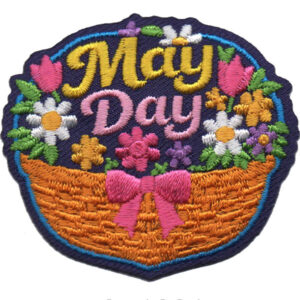 The May Day Patch (Copy) features a dark blue background with colorful embroidery: "May Day" text above a basket of pink, yellow, and white flowers topped with a pink bow.