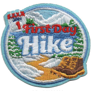 The Rain Hike Patch (Copy) features snowy mountains, green pines, a dirt trail, a brown hiking boot, and "1st First Day Hike" in red and white.