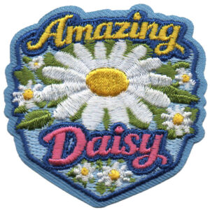 The Amazing Daisy Patch (Copy) is a vibrant embroidered patch showing a large white daisy with yellow center, smaller daisies, and "Amazing Daisy" in yellow and pink on a blue background.
