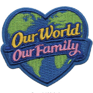 The Our World Our Family Patch is a heart-shaped embroidered patch featuring a world map, "Our World" in yellow, "Our Family" in pink across the center, and outlined in blue.