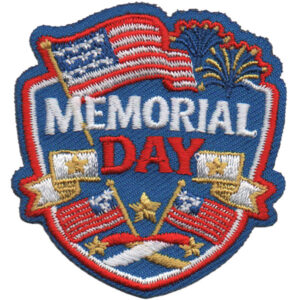 The Memorial Day Patch (Copy) is a shield-shaped embroidered patch with "Memorial Day," American flags, gold stars, and fireworks in red, white, blue, and gold.