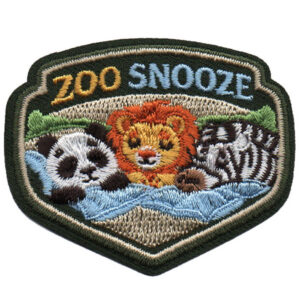 The Zoo Snooze Patch (Copy) is an embroidered patch showing a panda, lion, and zebra lying side by side under a blue blanket, with the words "Zoo Snooze.