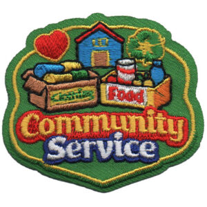 The Community Service Patch (Copy) features an embroidered heart, house, tree, a "Smile" box, a "Food" can, and bold red, yellow, and white "Community Service" lettering.