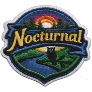 The Nocturnal Patch (Copy) displays "Nocturnal" with a river, trees, a sunset or sunrise, and a black animal—likely a raccoon—in a forest scene. It features an embroidered design with blue and white borders.