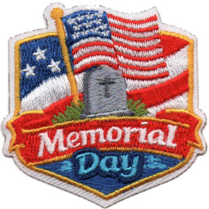 The Memorial Day Patch (Copy) is an embroidered patch with two American flags, a gravestone, and "Memorial Day" in red and blue lettering.