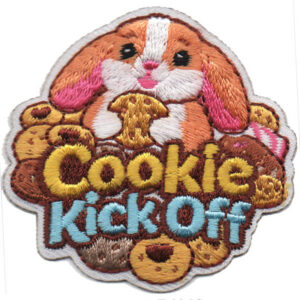 The Cookie Kick Off Patch features a cute brown and white bunny holding a cookie, surrounded by assorted cookies, with "Cookie Kick Off" embroidered in yellow and blue letters.