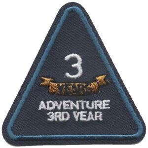 The Working As A Team Patch (Copy) is a triangular embroidered patch with a blue border, displaying “3 YEAR” above a gold banner and “ADVENTURE 3RD YEAR” in white below.