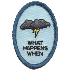The Wilderness Patch (Copy) features an oval design with a dark cloud and yellow lightning bolt above "WHAT HAPPENS WHEN" on a light blue background, finished with blue stitching.