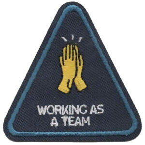 The Hidden Wonders (Copy) patch is triangular with a blue border, showing two yellow hands high-fiving above "WORKING AS A TEAM" in white on a dark background.